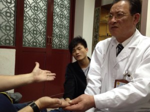 A doctor of Chinese medicine, diagnosing me