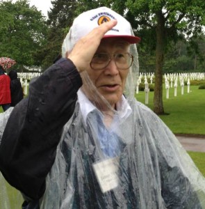 My dad, giving a salute to his fallen comrades at Omaha Beach Cemetery on the anniversary of D-Day